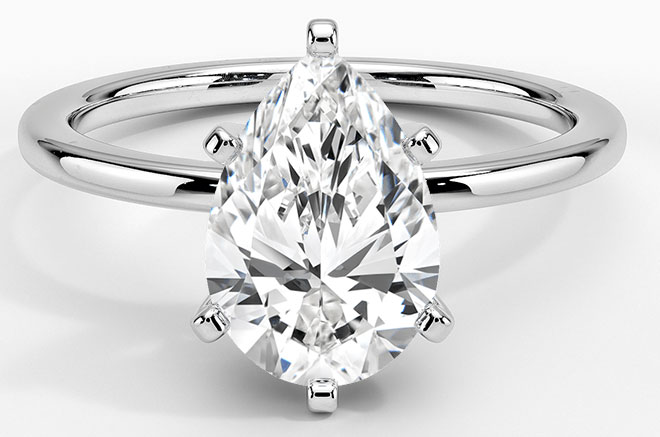 A 1.21 ct Fancy purplish pink pear shaped diamond engagement ring set in  18K gold. - GIA 4Cs